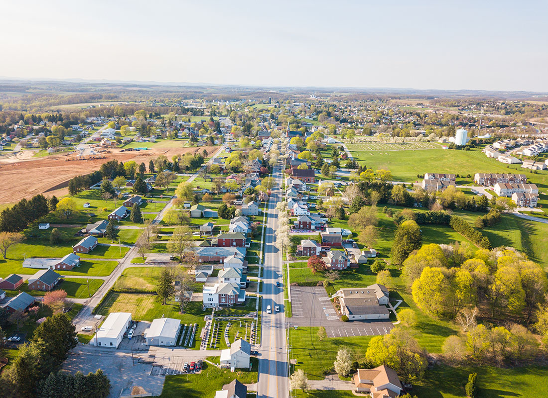 Cranberry Township, PA - Aerial View of Homes Surrounded by Green Grass and Trees During the Summer in the Small Town of Cranberry Township Pennsylvania